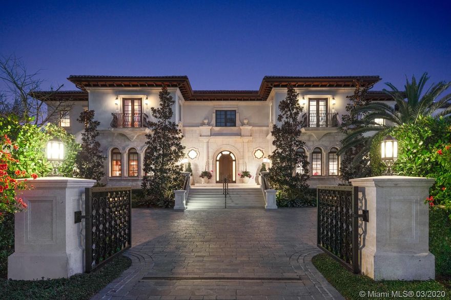 Located on the water’s edge in Gables Estates on a 42,253 sf lot facing a wide lagoon with direct bay access, this luxurious 15,522 total sf, 5BR/7+3BA palladian waterfront villa comes with picturesque views from several sitting areas. Downstairs are the formal living room, dining room, gourmet kitchen, breakfast room, family room with wet bar, and billiards room with a second bar, all with custom Venini glass lighting. The kitchen comes with a hidden butler’s kitchen and walk-in wine cellar for an equally impressive collection. Two home offices can be converted into additional bedrooms, and secret storage spaces are scattered throughout. Summer kitchen, saltwater heated pool, 180 ft dock with boatlift and ideal water features enhance this inviting home for both entertaining and leisure.