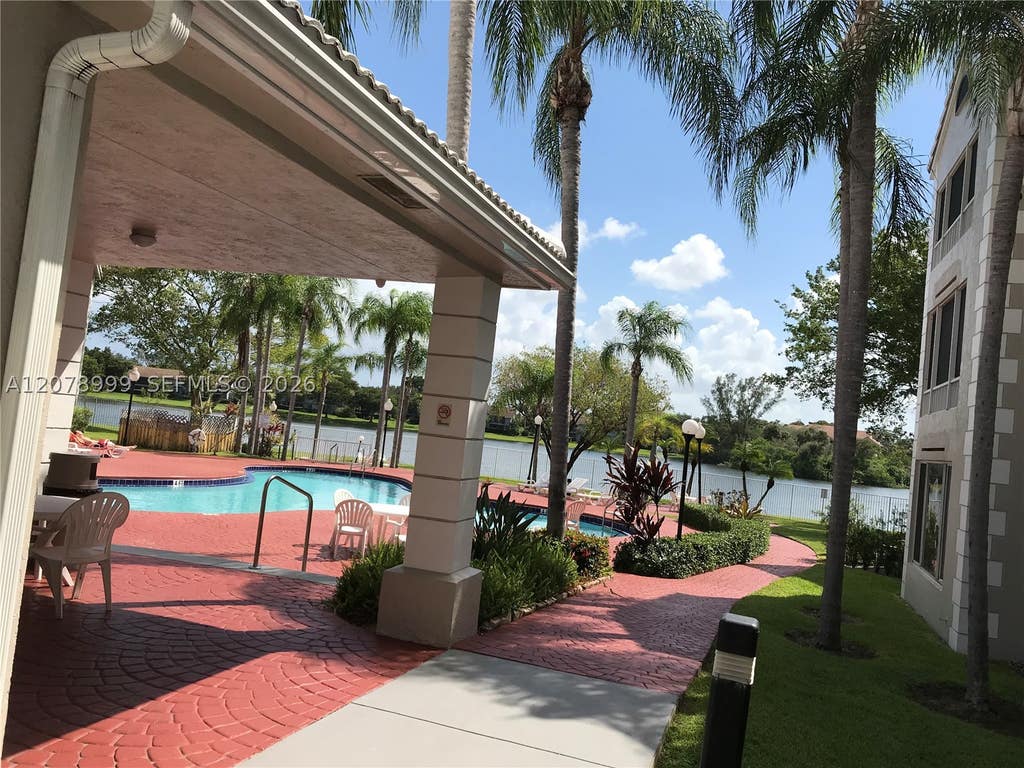 Photo of 2851 N Oakland Forest Dr #102, Oakland Park, FL 33309 (MLS # A12078999)