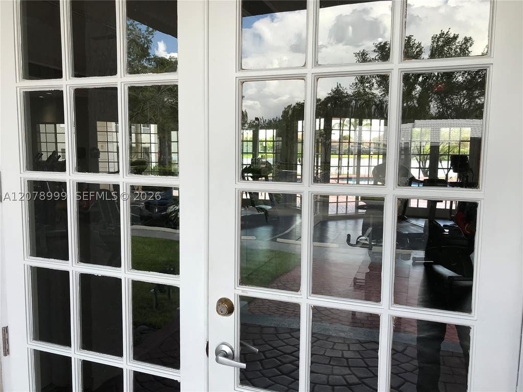 Photo of 2851 N Oakland Forest Dr #102, Oakland Park, FL 33309 (MLS # A12078999)