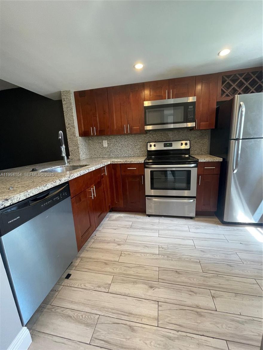 Beautifully renovated 1-bedroom condo located in the desirable Villas at Lakeview community. This unit features updated finishes throughout, including granite countertops, stainless steel appliances, and a convenient in-unit washer and dryer. Enjoy a spacious layout with a FULLY FENCED backyard with a view of the lake. The community offers a well-maintained setting with easy access to major roads, shopping, dining, and is centrally located just minutes from downtown Fort Lauderdale, Wilton Manors, and the beach.  Pet friendly (up to 40 pounds) with no pet deposit.