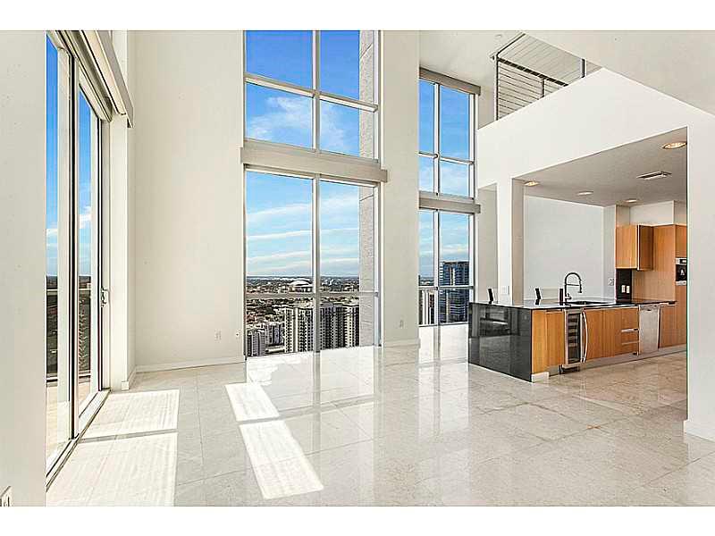 2564 SQ + Balconies. PH Corner unit with 180 degrees of unobstructed bay and city views. Impact resistant floor-to-ceiling windows and sliding glass doors that offer breathtaking views. 3 Bedrooms with 3 F-Bath. 3 Balconies, plus Half Bath. Beautiful marb le floors throughout the entire unit and custom built out closets. Laundry room with W/D. Open Kitchen with S/S Appliances, Dinning room, Florida room area + Family room. Master Room with his and her closet, shower and jacuzzi. 2 Assigned Parking Spaces