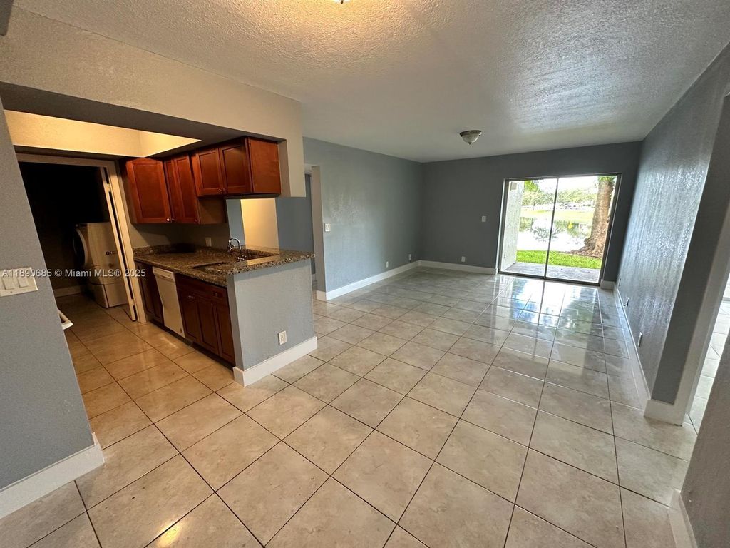 Photo of 5672 Rock Island Rd #240, Tamarac, FL 33319 (MLS # A11890685)