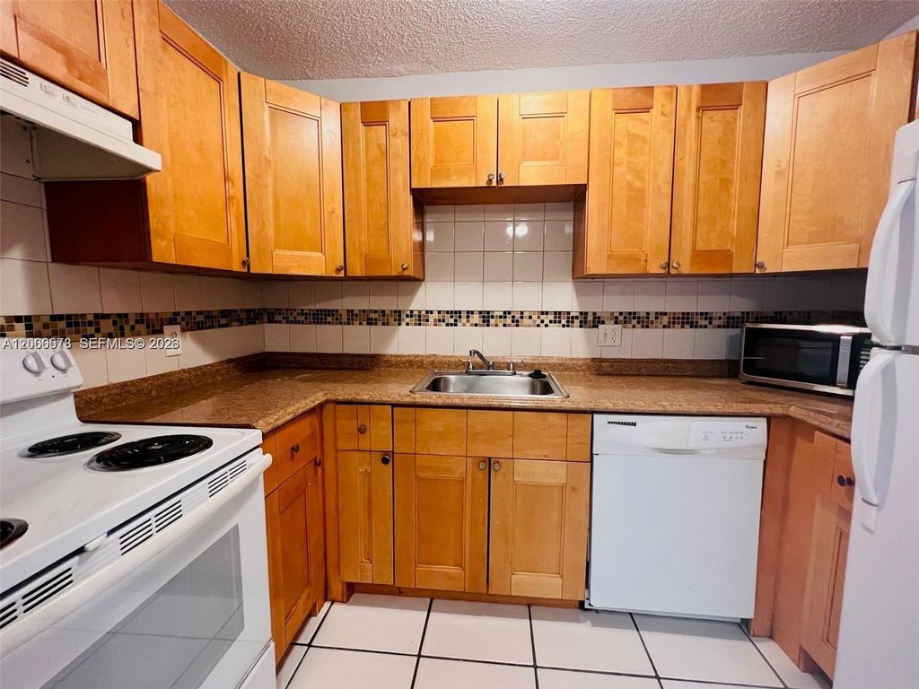 Photo of 10878 Royal Palm Blvd #10878, Coral Springs, FL 33065 (MLS # A12006578)