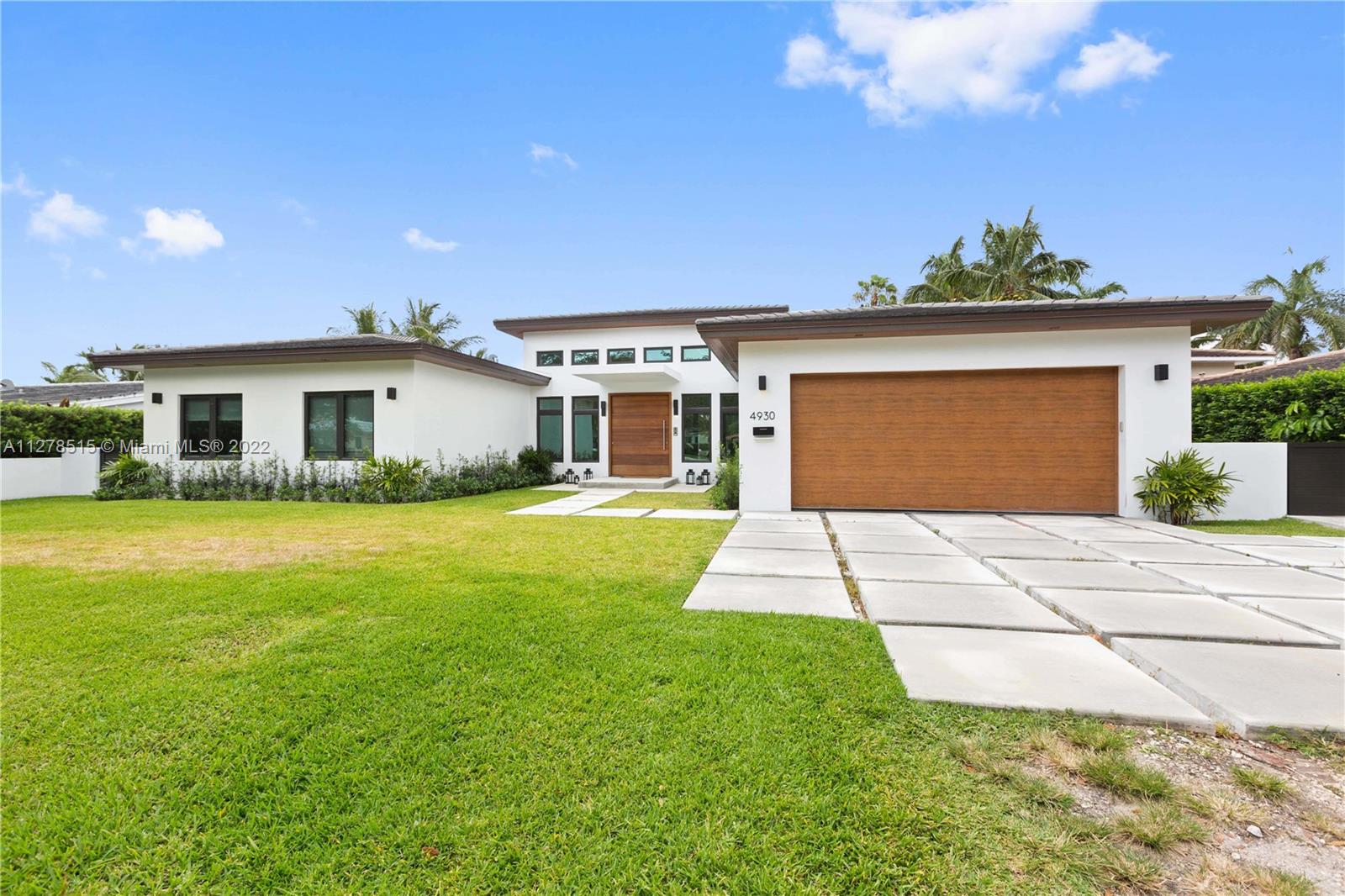 Brand new Coral Gables Waterway house is ready for you to call it home. Split plan, 4-bedrooms, 5-baths plus office on a large 13,600+ sqft lot. Enjoy the sunset on your dock and enjoy a glass of chilled champagne as families Manatees lazily swim past, then cool off in your delicious pool and rinse off in your cabana shower before relaxing in your covered patio. This 4000 sq ft home has high ceilings, porcelain floors top quality impact windows and doors and was just completed. It has a two car garage and once you tie your boat to the dock, you’ll be only a 20 minute ride through Miami’s most beautiful waterway to Biscayne Bay and beyond! This is what South Florida is all about.