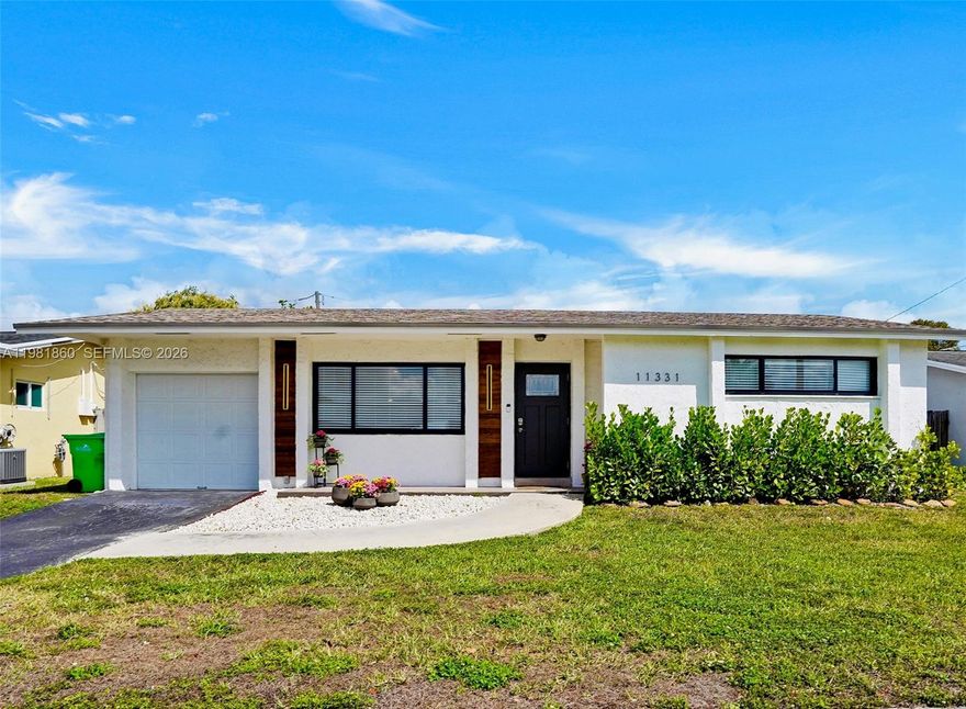 Step into this warm and inviting home where comfort meets thoughtful upgrades. Designed with cozy yet elevated feel, this home features a modern kitchen, updated flooring, & an upgraded electrical panel completed in 2021, along with a new A/C & beautifully remodeled bathroom in 2023. The roof was replaced in 2018, offering added peace of mind.
The home also includes a Florida room/den that can easily serve as an additional bedroom or flexible living space, plus a converted garage with utility room featuring additional room that is currently used as a recording studio/game room, but can be used as a home office or gym. 
Additional highlights include a tankless water heater, high-impact windows and front door and shutters for the back windows. Ideally located near the athletic complex & Welleby Park and just a short drive to Sawgrass Mills Mall for premier shopping & dinning. 
A charming and stylish home ready to welcome its next owners!