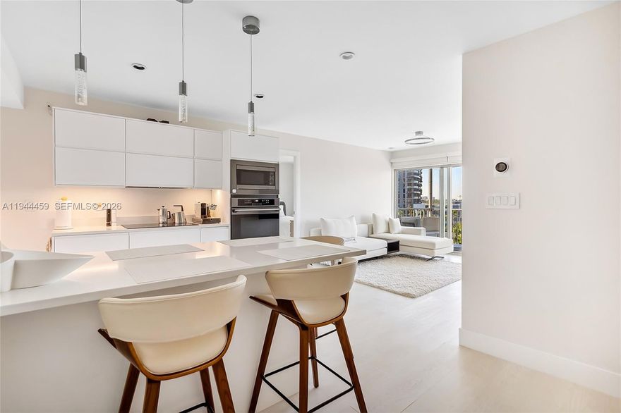 Top-floor penthouse with stunning panoramic views of the Greg Norman golf course. Quiet and private setting, 2 full bathrooms, walk-in closet in the primary bedroom and a spacious built-in closet in the den.

Fully designer-renovated in 2022 with permits. Everything is new: layout, floors, ceilings, walls, plumbing, electrical, air ducts, insulation, impact windows and balcony door. 8’ ceilings throughout, modern lighting with dimmers and night mode, high-end bathrooms with frameless showers and premium European fixtures. Custom IKEA kitchen with top-tier built-in appliances and water filtration system.

Sold fully furnished and equipped with quality furniture, appliances, TV, accessories, and kitchenware. Includes covered parking and extra storage.

Community amenities include a heated pool, gym with bay views, sauna, game room, BBQ/sundeck overlooking the golf course, and a fishing pier. 50-year recertification completed.

Prime location: 10-minute walk to Hollywood & Hallandale beaches, close to shops, restaurants, and services. Maintenance includes water, in-unit pest control, internet, and basic cable. No leasing allowed.
DISCLAIMER 1-bedroom + converted den to 2nd bedroom