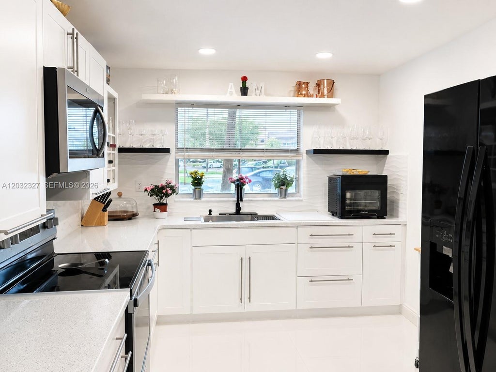 Photo of 9241 Sunrise Lakes Blvd #109, Sunrise, FL 33322 (MLS # A12032327)