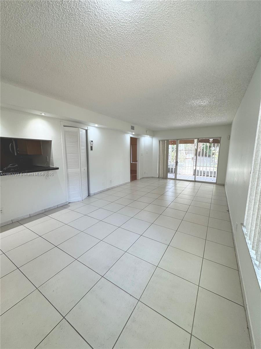 Spacious Corner 2/2 with Two Assigned Parking Spaces. This unit has a split floor plan with a Screened Porch, In Unit Washer/Dryer, Newer appliances, Freshly Painted, New Fixtures, Second Bedroom has direct bathroom access and Large Backyard with Shed.