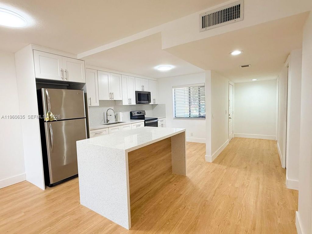 Photo of 440 S Lake view Dr #102, Fort Lauderdale, FL 33326 (MLS # A11960635)