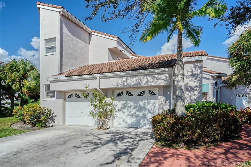 Enjoy lake views from this 2 bed + den /2.5 bath coach home located in the gated community Encino in Grand Palms. Spacious unit with large screened in balcony to relax & enjoy views of the lake.  Spacious master suite w/ 2 large custom walk-ins, shower, jetted tub, & dual sinks. Split floorplan,laundry room, & 1 car garage. Maintenance free living at it's best w/ insurance, cable, alarm, water, & roof/exterior all covered in monthly maintenance. Come make this house your own!