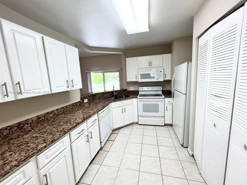 Photo of 3457 NW 44th St #204, Oakland Park, FL 33309 (MLS # A11874468)