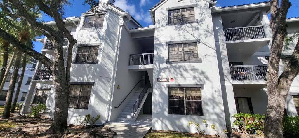 Photo of 11295 W Atlantic Blvd #303, Coral Springs, FL 33071 (MLS # A11950752)