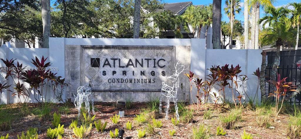 Photo of 11295 W Atlantic Blvd #303, Coral Springs, FL 33071 (MLS # A11950752)