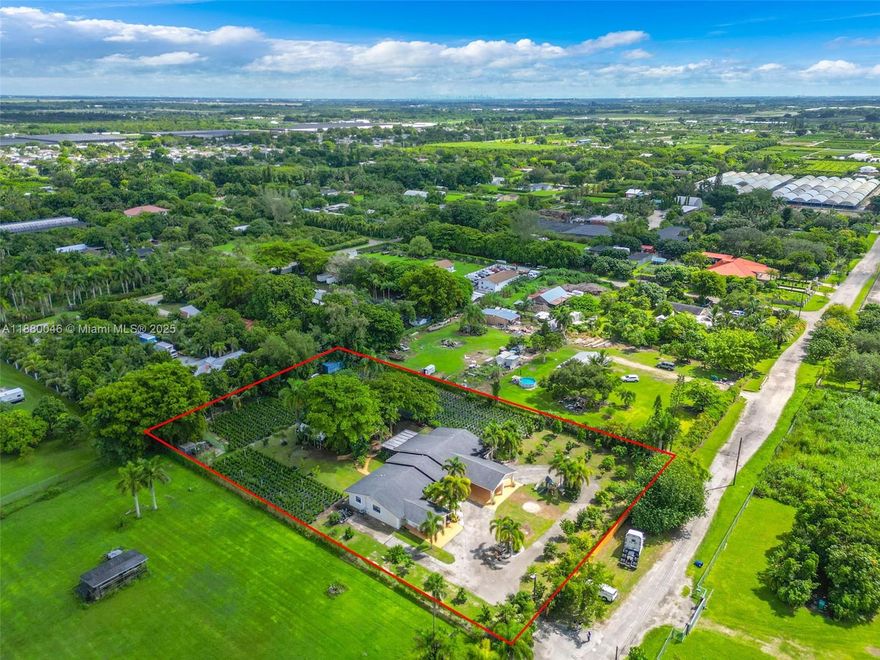 Redland gem on 1.4 acres! Paved Road ! Spacious main house 5 bed, 3.5 bath home + remodeled 1/1 detached guest house. 1 car garage can easily be converted to an additional room as it has a split A/C . Income-producing Clusia business + chicken coop for self-sustained living. Over 50 Fruit Trees ! Perfect to keep as is or for your needs as the entire lot is set up with a new irrigation system!  Ideal for multi-gen families, investors, agricultural use. Property is fully fenced, landscaped-  plenty of room for expansion RV , Boat , Truck parking. 
Electric utilities have been converted to underground! Property is located in a peaceful, sought-after area yet close to major roads. Listed below recent appraisal–incredible value with income potential.
OPEN HOUSE 10/26! 11AM-1PM