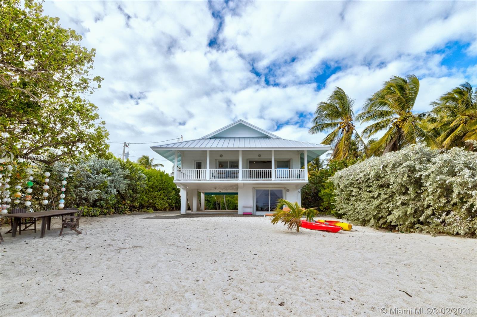 MM 76.5 Sensual,seductive and sublime, are but a few of the ways to describe this phenomenal Florida Keys beachfront oasis. Rare sandy beach offers year-round enjoyment and serenity. Extraordinarily private and far removed from the Highway, this 2/3-acre property offers 70 Ft of prime Islamorada Ocean frontage. With timeless architecture and design, this exceptionally well-built, updated, and stylish home was created to bring the outside vistas and sea breezes in. Its large veranda and cascading sliding glass doors help capture the Caribbean Bungalow Vibe. Stainless and quartz open kitchen offers stunning views.
Metal roof, carport,and EXTRA-large downstairs storage area
Space for a 2nd bathroom
Plenty of room for pool and to expand the existing house or build a new main or guest house.