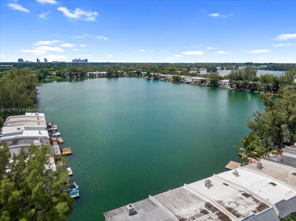 Discover an incredible opportunity in Lakeridge, Miami’s beloved guard-gated lakeside community. This rarely available 3BR/3.5BA townhome is one of the largest models in the neighborhood and offers endless potential for the visionary buyer. The home is ready to be reimagined into your modern dream residence. Enjoy serene lake views, an expansive floor plan, and private outdoor spaces, all set within a tranquil enclave of only 170 homes. Lakeridge residents enjoy a unique lifestyle with 2 pools, swimmable lake, community docks, walking trails, tennis, pickleball & basketball courts, playground, butterfly garden, and lush park-like grounds. With spacious living, abundant natural light, and an unbeatable location in the heart of Miami, this is a chance to create something truly special.