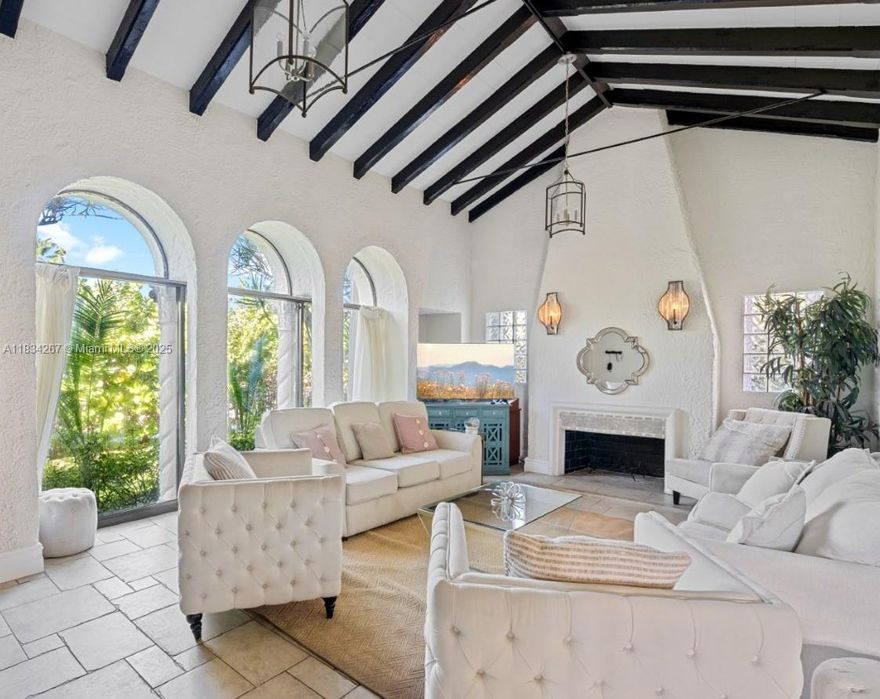 Captivating Spanish-style villa, nestled on a rare double lot in the heart of Hollywood Lakes. Beautifully curated estate featuring a main house with 2 beds and 1.5 baths, and two separate 1-bed, 1-bath guest houses, making it ideal for multigenerational or extended family living. Interior blends charm and sophistication with exposed wood beam ceilings, a fireplace, and a formal dining. The spacious layout includes soaring vaulted ceilings and comes fully furnished, ready for you to move in. Outdoors, your own private courtyard oasis awaits, featuring a resurfaced pool, lush tropical landscaping, and plenty of space to entertain or unwind. The estate’s prime location puts you minutes from the beach, Downtown Hollywood, Broadwalk, and FLL International Airport.