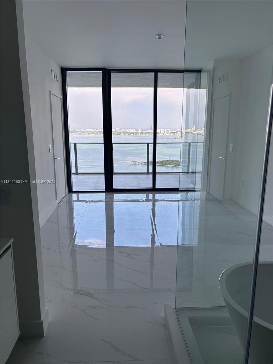 LUXURY LIVING !!!! READY TO MOVE IN !!! Enjoy 2 acres of exclusive amenities with unobstructed water views. from this New 2025 Luxurious 3-bedroom, 3.5- bathroom + DEN. Enjoy 1,750 sqft of living area, and a stunning 229 sqft terrace with direct water views. a private sports marina for paddle boarding and kite kayaking, a three swimming pool two of them overlooking the water. Amazing fitness center, wellness spa, kids' playground, wine lounge, state-of-the-art library, party room, lap pool, tennis and paddleball courts, half-court basketball, and mini golf... 15 minutes from Miami international, airport design District, Midtown, Brickell..... Great Location.