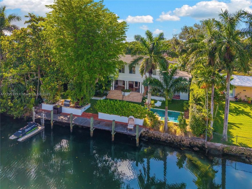 This stunningly remodeled home features 100’ of water frontage with Bay access in the heart of Coral Gables, close to everything! The 4 BR, 4 BA  property spans 3,619 SF on a lush 12,000 SF lot.  Enter through a charming courtyard to find a wonderfully open-concept floor plan w/ a fabulous kitchen including high-end appliances & large island, ample living room, and dining room w/ beautiful built-ins. Spanning the back of the house is a deep covered patio that overlooks the pool & waterway beyond! Upstairs, the private primary suite includes an office, sizable BR, 2 walk-in closets, & lovely BA.  Downstairs you will find 3 add’l BRs with walk-in closets, & 3 BAs. With impact glass throughout, fabulous updates & more, this is an incredible opportunity not to be missed!