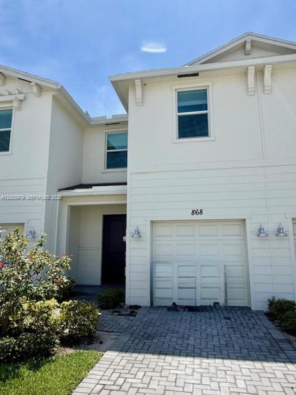Photo of 868 SE Grovebush Ln, Port St Lucie, FL 34984 (MLS # A12003979)