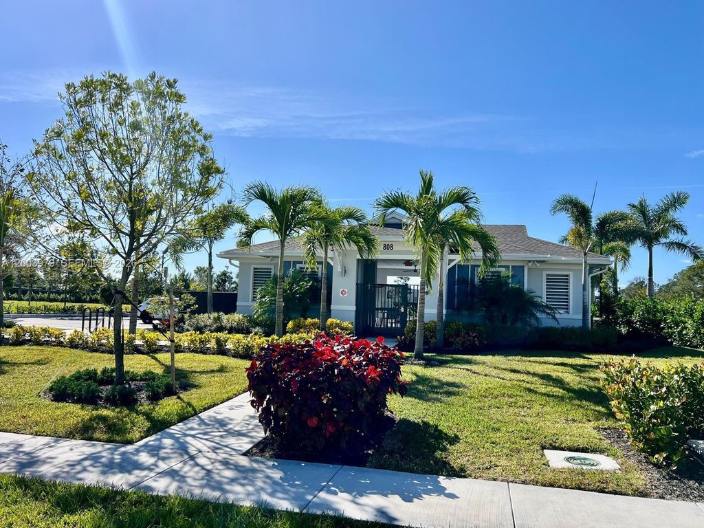 Photo of 868 SE Grovebush Ln, Port St Lucie, FL 34984 (MLS # A12003979)