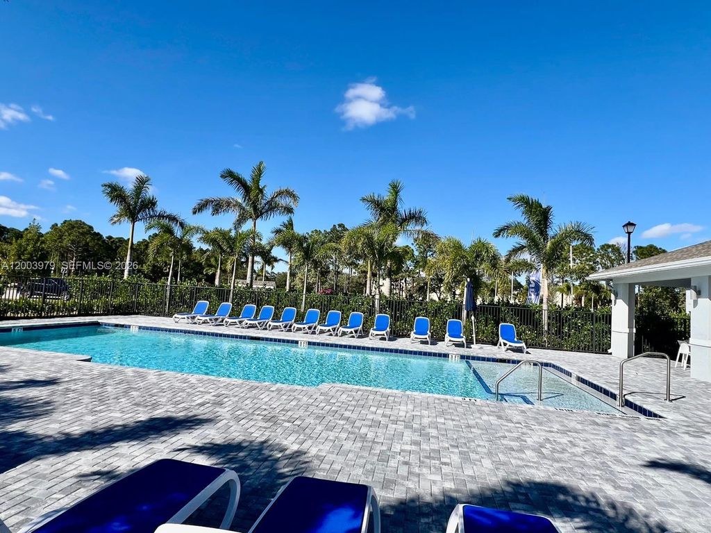 Photo of 868 SE Grovebush Ln, Port St Lucie, FL 34984 (MLS # A12003979)