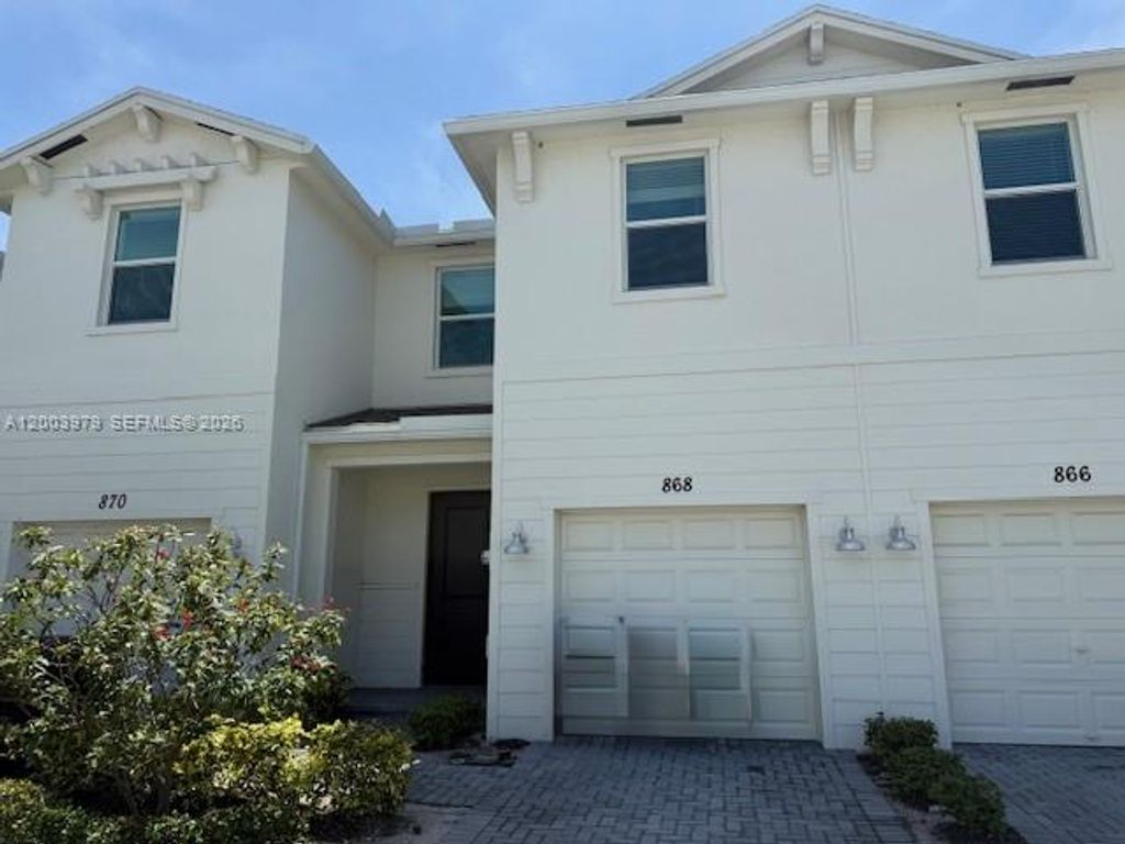 Photo of 868 SE Grovebush Ln, Port St Lucie, FL 34984 (MLS # A12003979)