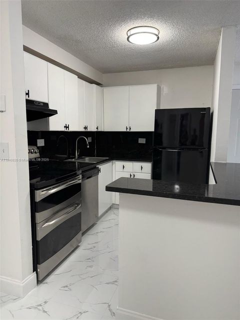 Photo of 7010 NW 179th St #105, Hialeah, FL 33015 (MLS # A11840820) Photo of 7010 NW 179th St #105, Hialeah, FL 33015 (MLS # A11840820)