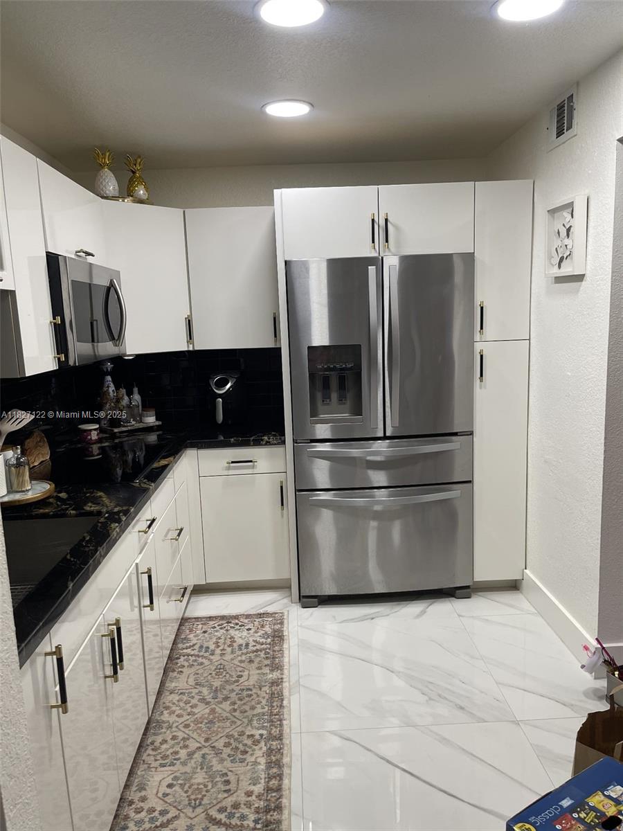 Remarkable and totally remodeled 2 bedrooms, 2 bathrooms in a central part of Miami Lakes. Beautiful brand new floors ceramic tiled floors, remodeled kitchen with marble counters, high end cabinetry and stainless steel appliances. Bathrooms have also been remodeled with high end finishes. Impact windows throughout and sliding door is also impact. Terrace is also cozy and clean with enough privacy to cook outdoors. Amenities include pool, clubhouse, 24 hour car security, and even assigned spaces and guest parking. Looking for the perfect tenant to come and enjoy this magnificent property. Very central to amazing restaurants, shopping centers and highways.
