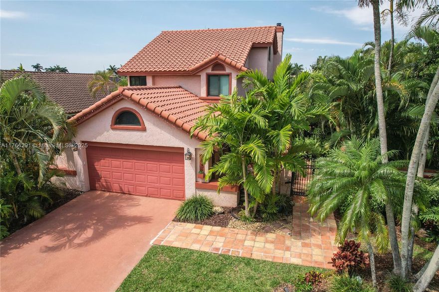 Incredible bright waterfront home with stunning open-concept layout, 3 bedrooms, 2 1/2 baths, spacious loft, family room, 2 car garage (equipped for charging 2 electric vehicles), and working fireplace. The enormous fenced backyard has a porch, balcony, screened enclosure, jacuzzi spa, firepit, fruit trees, plus canal ideal for kayaking, boating, fishing, and even waterskiing. Impact windows and doors, automatic sprinkler system, AC 2021, Electrical panel 2022, Dishwasher 2024, renovated kitchen with stainless steel appliances. Located in the desirable Starlight Cove neighborhood, close to the Village of Hillsboro Park which has a boat ramp, playground, barbecue areas, basketball courts, volleyball court, and tennis court. Short drive to the beach, easy access to I-95 and Turnpike.