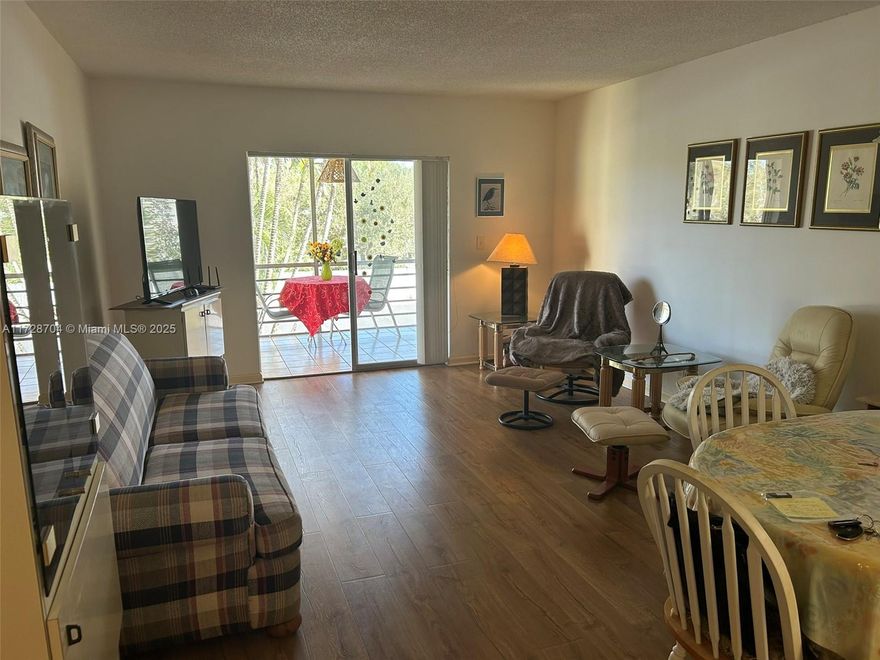 Reduced-  Spacious 1/1 Condo (2nd floor) - 55+ community - large bedroom w walk-in closet, remodeled bathroom, new appliances - dining living room - large screened Florida room with storage - Tile and laminate floors - furnished and equipped - next to laundry facility - Water included - Very dynamic complex with Tennis, Pickle ball courts, shuffleboard, Bocce, BBQ, patio and heated pool, Clubhouse with Billiard tables, library, Gym and meeting room. Social program of activities - gardens with mature trees and flowers. 1 assigned parking space, plenty of guest parking spaces. Rental allowed (restrictions apply) - Near highways, stores, 6 miles to Beach and airport -FIRPTA - Condo fees $412/month- Motivated Seller bring an offer! all offers will be considered!