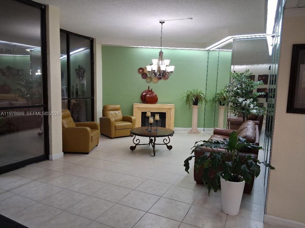 Photo of 1100 St Charles Pl #213, Pembroke Pines, FL 33026 (MLS # A11978689)