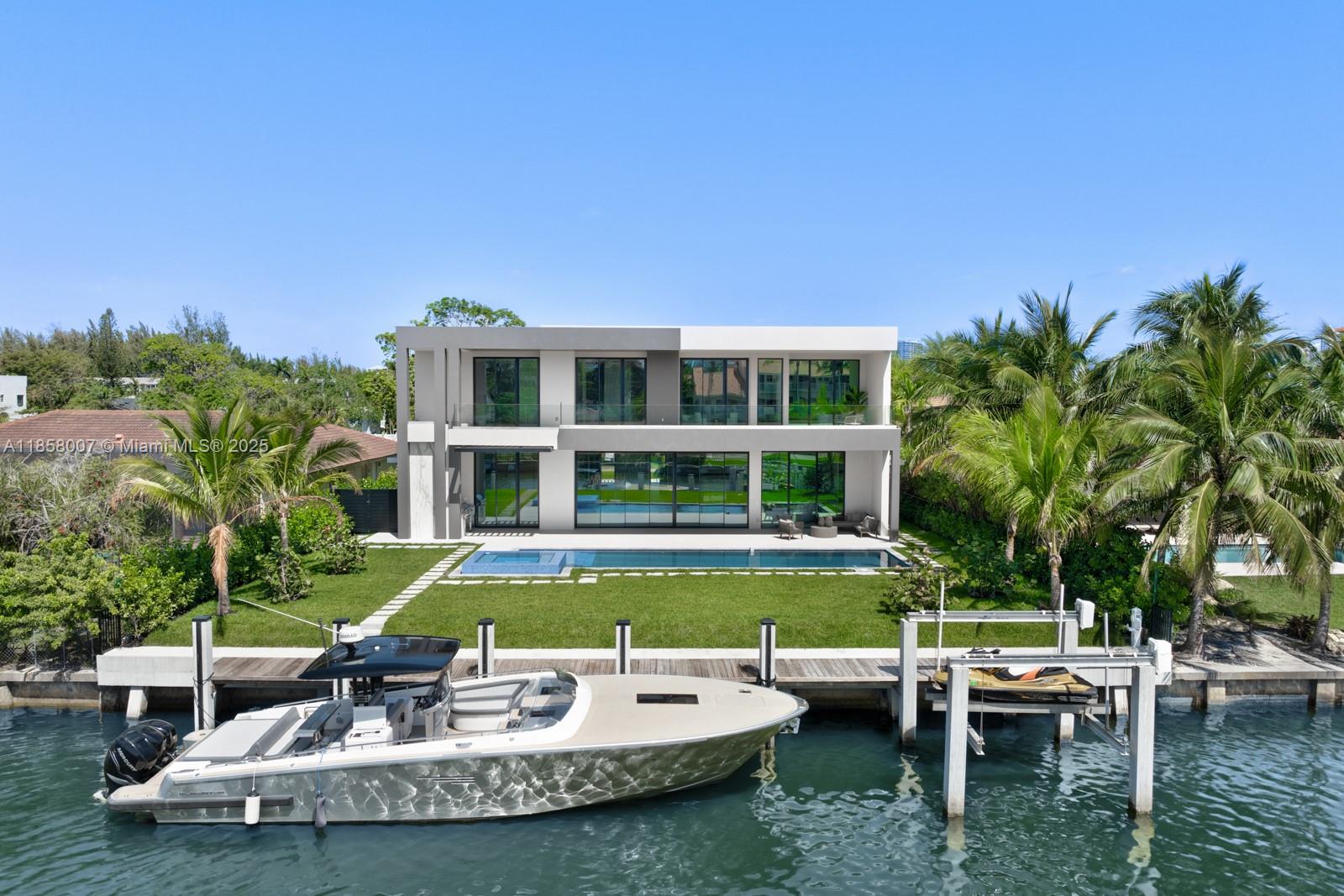 Crafted by renowned Barreto Constructions, this brand-new 6BD/6BA/2HB, waterfront masterpiece offers 85’ of linear canal frontage with ocean access. Set in a private gated community with park, dog park,multiple tennis courts, minutes from beaches and golf. This magnificent home boasts a sleek Italian marble kitchen with top appliances, smart glass system ideal for social gatherings, premium sound system, wine cellar 160+ bottles, summer kitchen with draft beer dispenser, pool-spa, relaxing patio area, spacious balcony, confortable bathrooms and walking closets, and a 3-car luxury garage. Featuring a Laundry Jet system, 2 coffee stations, and ultra-luxury finishes, this partially furnished estate redefines modern elegance and the luxury living you deserve. Schedule your showing