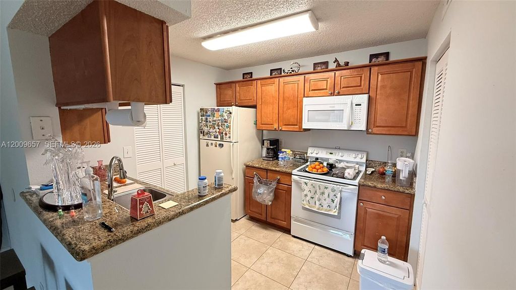 Photo of 4055 W Mcnab Rd #H206, Pompano Beach, FL 33069 (MLS # A12009657)