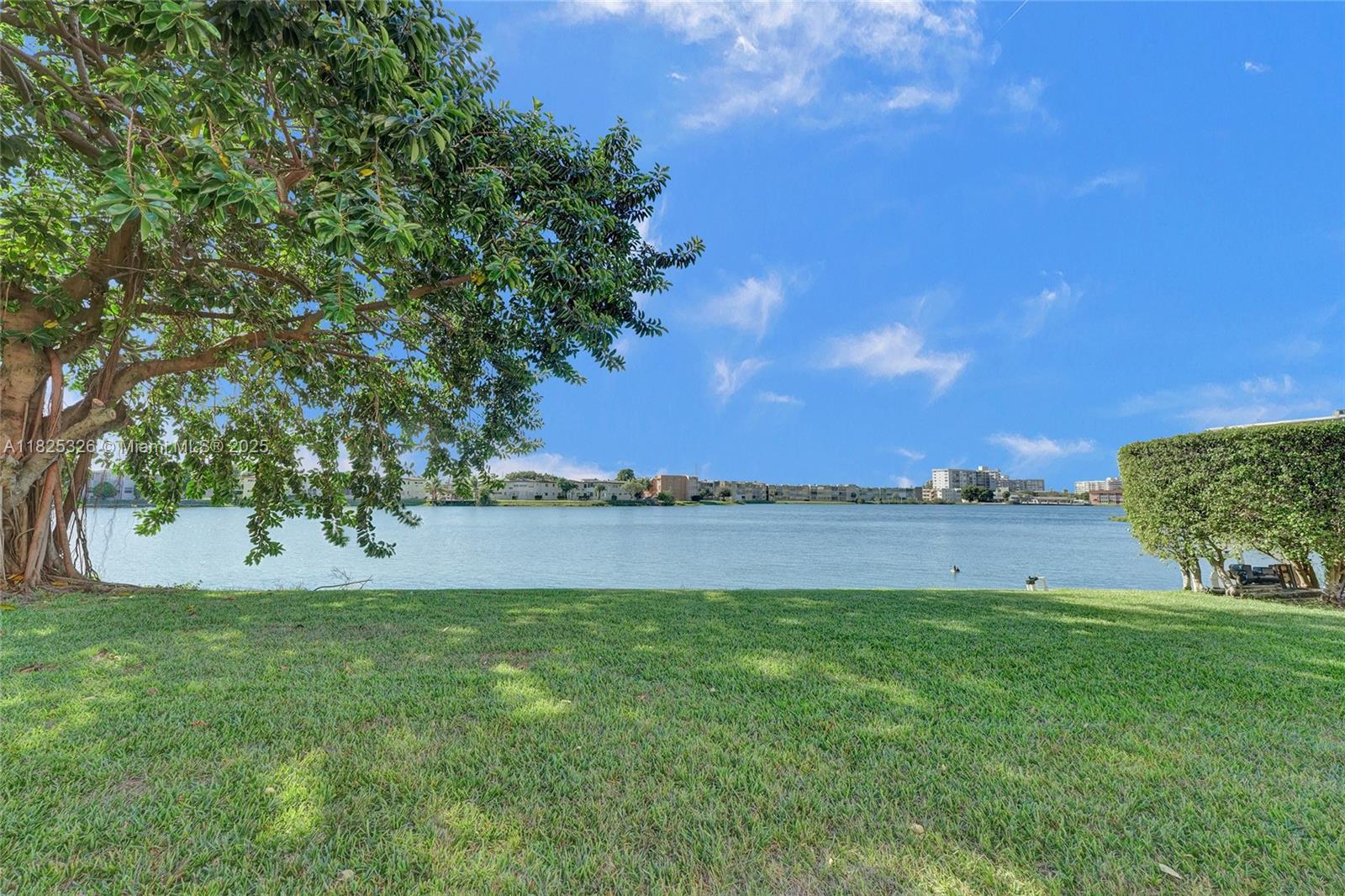 Welcome home to this lakefront 1st floor condo offering a perfect combination of convenience, comfort, and style. This condo is in a prime location close to everything Miami has to offer. Close to Aventura mall, shopping, hospitals, great schools and i95. Enjoy peaceful views of the lake and pool from the private patio. AC only few years old. The community offers unlimited guest parking and is secured with a guard gate 24 hours, providing peace of mind and safeness. With low maintenance fees and special assessments all PAID by the seller, this unit won't last long. Schedule your showing now, easy to show.