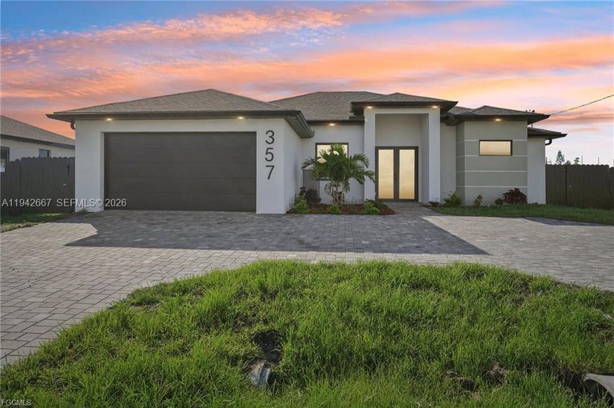 This stunning new construction home offers the perfect blend of elegance, comfort, and Florida lifestyle living. 4 Bedrooms | 2 Full Bathrooms | 2-Car Garage with over 1810 Sq Feet of Air-Conditioned Living Space. Concrete Block Construction with Hurricane-Impact Windows & Sliders Beautifully Landscaped, Fully Fenced Backyard NOT IN A FLOOD ZONE City Water & Sewer. Gorgeous brick circular driveway. Sparkling saltwater pool with sun-shelf for lounging, Outdoor shower and outdoor kitchen with sink, LED lighting & dual fans. Fully fenced yard with plenty of space. Elegant tray ceilings and electric fireplace in the living area. 24” x 48” Porcelain Tile Flooring throughout the entire home. Chef’s kitchen with: Expansive quartz waterfall island with built-in wireless chargers. Double ovens, convection microwave, and stainless-steel appliances. White & brown-toned cabinetry with LED lighting accents. Formal dining room for family gatherings and entertaining Stylish interior doors throughout the home. Remote-controlled ceiling fans in every room for comfort and convenience. Spa-Like Bathrooms. LED-lit mirrors and floor-to-ceiling tiled glass showers. Modern floating vanities for a clean, contemporary look. Primary suite includes Tray ceiling. His & Her walk-in closets. Double vanity with his & her sinks. Additional Upgrades: Epoxy-finished garage floors. Energy-efficient LED lighting throughout. Beautifully landscaped grounds. Close to shopping, dining, and entertainment.