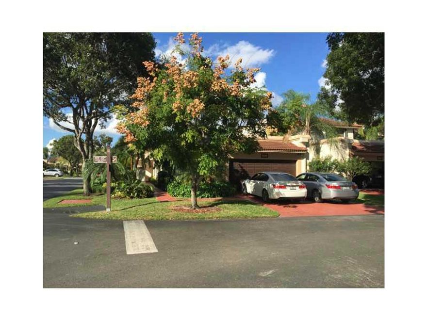 Exclusive Doral Colony town home located inside of Doral Estates, surrounded by Trump National Doral Country Club newly renovated golf courses. Fantastic corner, one story 3 bedroom, 2.5 baths, features Vaulted ceilings, remodeled kitchen w/ stainless ste el appliances and granite counter tops. Large screened patio w/ porcelain tiles throughout, also a large fenced back yard. Club house w/ beautiful large pool and two tennis courts.  Guarded 24/7. 2 car garage w/plenty of storage cabinets.