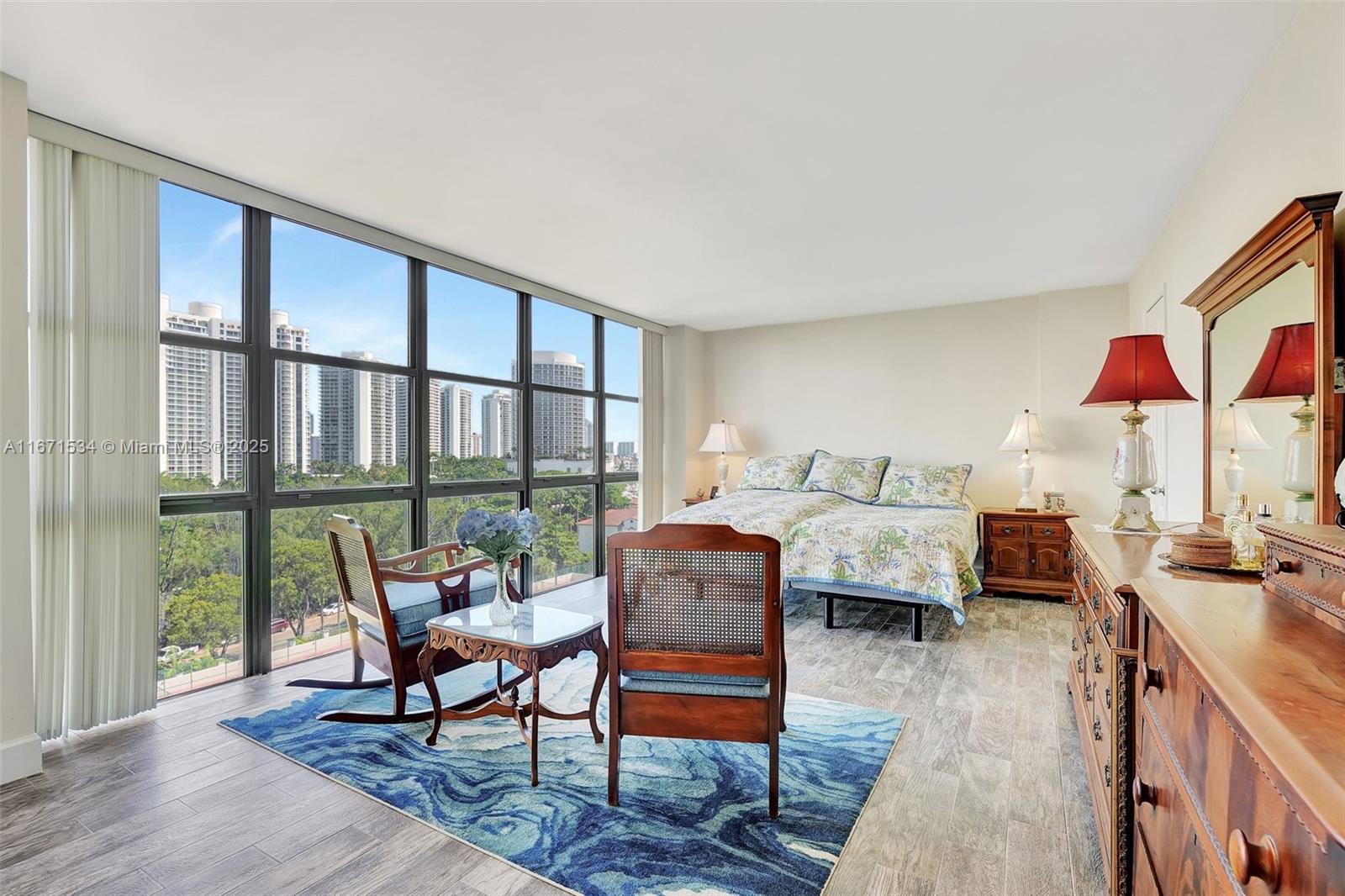 Discover this gorgeous corner 2-bedroom, 2-bath condo at Biscayne Cove, showcasing spectacular southwest views of the lake, Aventura Skyline, and nearby marinas. This spacious corner unit features an open floor plan with floor-to-ceiling windows, a large living area, formal dining room, breakfast nook, and an abundance of closet space, including walk-in closets. The condo also offers an open balcony to enjoy the beautiful views, extra storage, and covered parking. Biscayne Cove provides a wealth of amenities, including a lovely lobby, 24/7 manned guard gate, doorman, valet, two pools, tennis courts, exercise room, recreation room, spa, sauna, and hot tub—all conveniently located near Aventura Mall, schools and vibrant community.