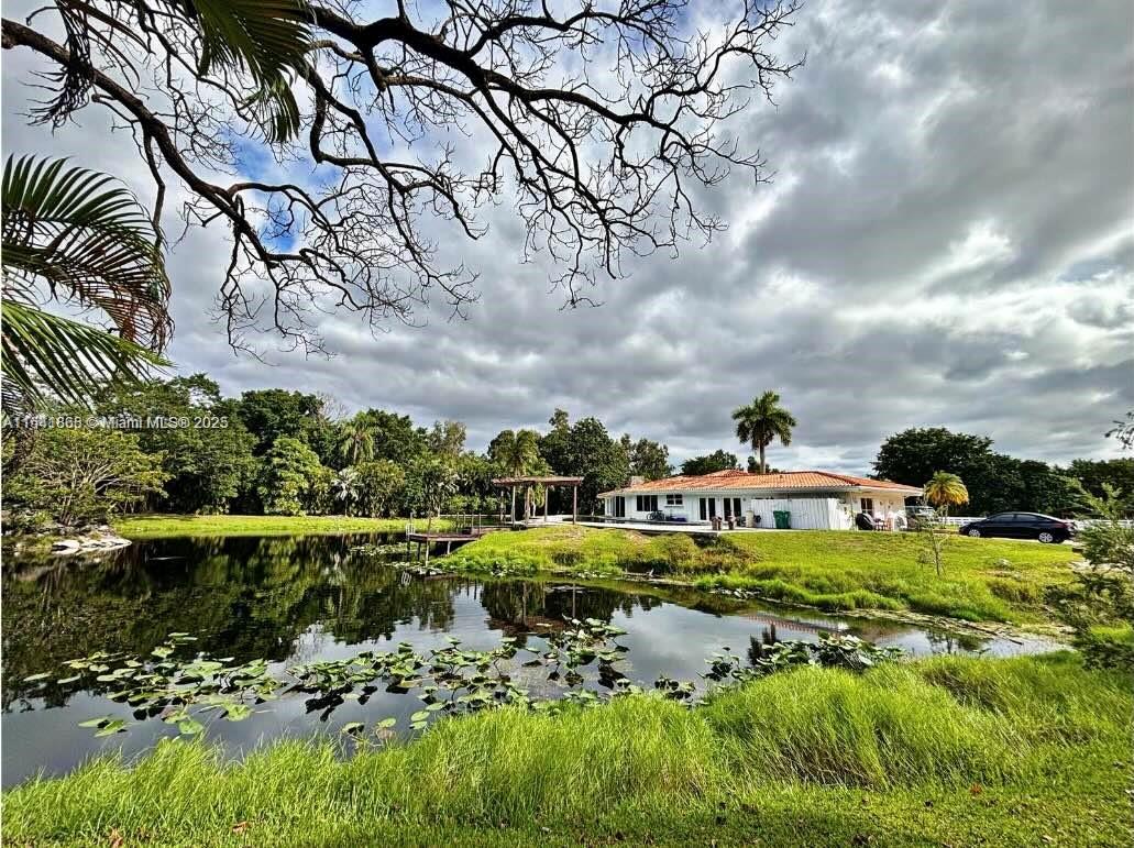 Home on nearly 4.3 acres in Sunshine Ranches. This estate showcases a main residence, guest house/office, and a spacious stable with 18 partitions. The main house offers 3 suites bedrooms & an additional bedroom w/a bath & a half bath. The guest home w/1 bedroom is used as an administrative office& kitchen. The home needs some TLC and updates, needs a new pool, roof.