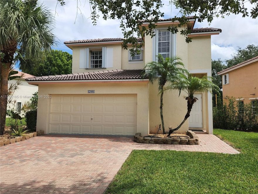 Welcome home to Pembroke Isles! This home is in a quiet,family neighborhood.Located on the lake for peaceful views and natural breezes to enjoy.This home has a big yard and a huge pergola covered patio that is great for outdoor entertaining.The home features 4 bedrooms, 2.5 baths & 2 car garage.The master bathroom has been fully updated with beautiful stone finishes, jacuzzi tub,dual sinks & new shower.The master bedroom has a large walk in closet and is on the is on the ground floor.The kitchen has been fully upgraded with granite counters,wood cabinetry w/lights & SS appliances.All tile floors & wood on the stairs.Cable,internet,lawn care,security incl.,community center has 3 pools,Fitness center,clubhouse,kids playground,tennis,soccer,basketball,fishing pier and much more!