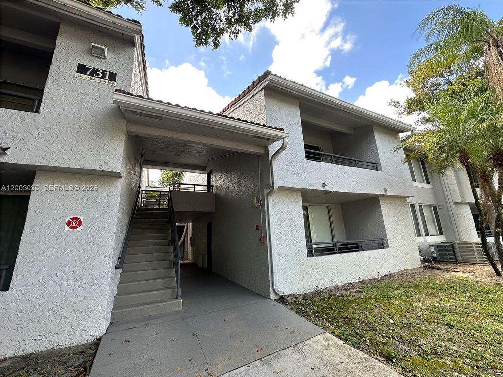 Photo of 731 Lyons Rd #16203, Coconut Creek, FL 33063 (MLS # A12003035)