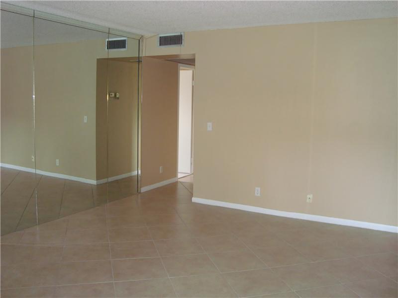 Beautiful 2 bedroom, 1/5 bath, corner unit on ground floor with central A/C. Tiled thru-out, glass top range built microwave. Convenient 1st floor location, enjoy all the amenities of CENTURY VILLAGE. 55 & over community. Corner unit, located on ground f loor. ONE OCCUPANT MUST BE 55.