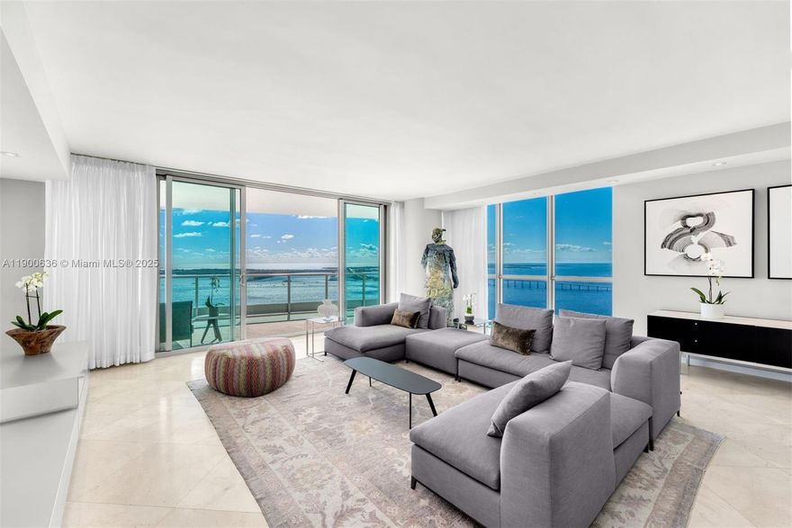 Experience the epitome of luxury at JADE Brickell with unobstructed Biscayne Bay and skyline views. This expansive 3,415 SF corner residence offers 4 bedrooms, 4.5 baths and 3 terraces capturing both sunrise and sunset. Designer interiors feature high ceilings, honed Saturnia marble & hardwood floors, a renovated chef’s kitchen w/Miele & Sub-Zero appliances, built-in coffee maker & dual wine coolers. The primary suite offers a walk-in closet & spa-style bath w/separate vanities. This rare offering includes 4 parking spaces & a private storage unit. Oversized floor-to-ceiling windows w/soundproof glass ensure a tranquil atmosphere while maximizing coveted southeastern exposures plus a private elevator to a dedicated foyer & resort-style amenities. Welcome to the pinnacle of Brickell luxury.