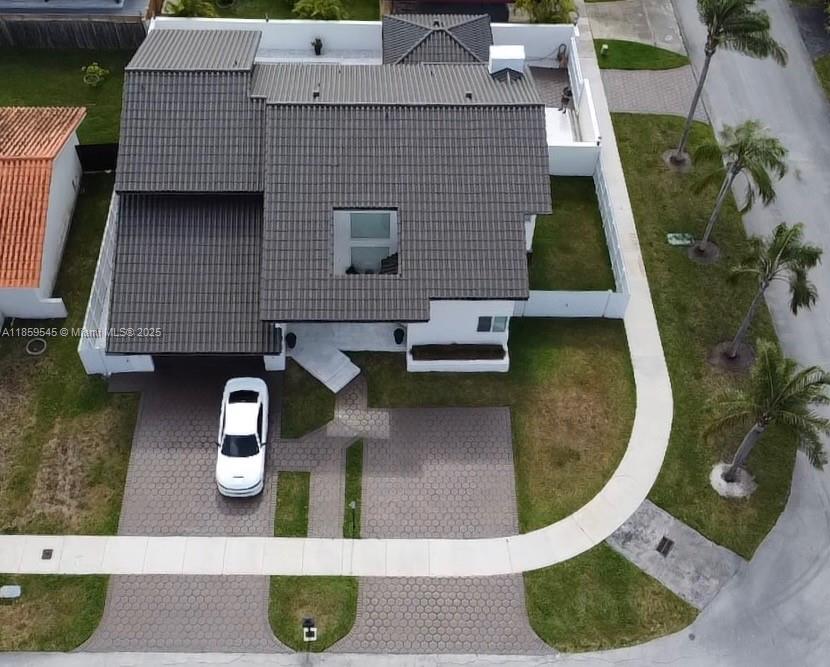 Elevate your expectations in this stunning custom built home! Bring your pickiest buyer! Ideal for modern family living. Open concept, gourmet kitchen with new appliances and oversized island, ample entertainment area, oversized bedrooms and bathrooms, double balcony, impact windows, impact doors, new A/C 2023, roof 2016, new insulation, custom garage flooring, large yard, pool completed remodeled in 2023, outdoor cabana with sitting area and 1/2 bath. This pristine corner lot comes with plenty of room for an RV or boat. This home was completed remodeled and is fully automated to control lights indoor/outdoor, pool, A/C and much more around the home from the touch of an App. Close to major highways and sought out A+ schools! Schedule your tour today!