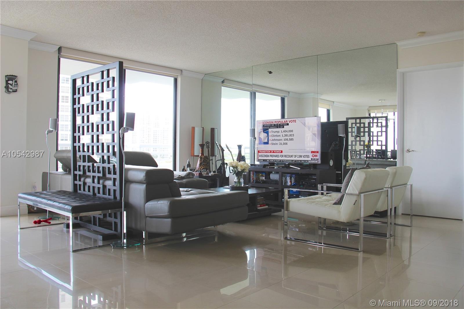 Attention. Available starting January 13, 2019 Modern luxurious condo and beautiful remodeled Corner unit with top of the line new appliances. 2 private assigned parking spaces and breath taking views. Visualize yourself enjoying a nice 180 degree views of the Country Club golf course and Sunny Isles beach.Watch the flamingos from your balcony and enjoy this building private pool.Washer and dryer inside unit,1 mile from the beautiful sunny isles beach. Fully upgraded modern closets.Natural Light will enlighten your stay. Building has gym, pool, barbecue area and many more Wont Last
