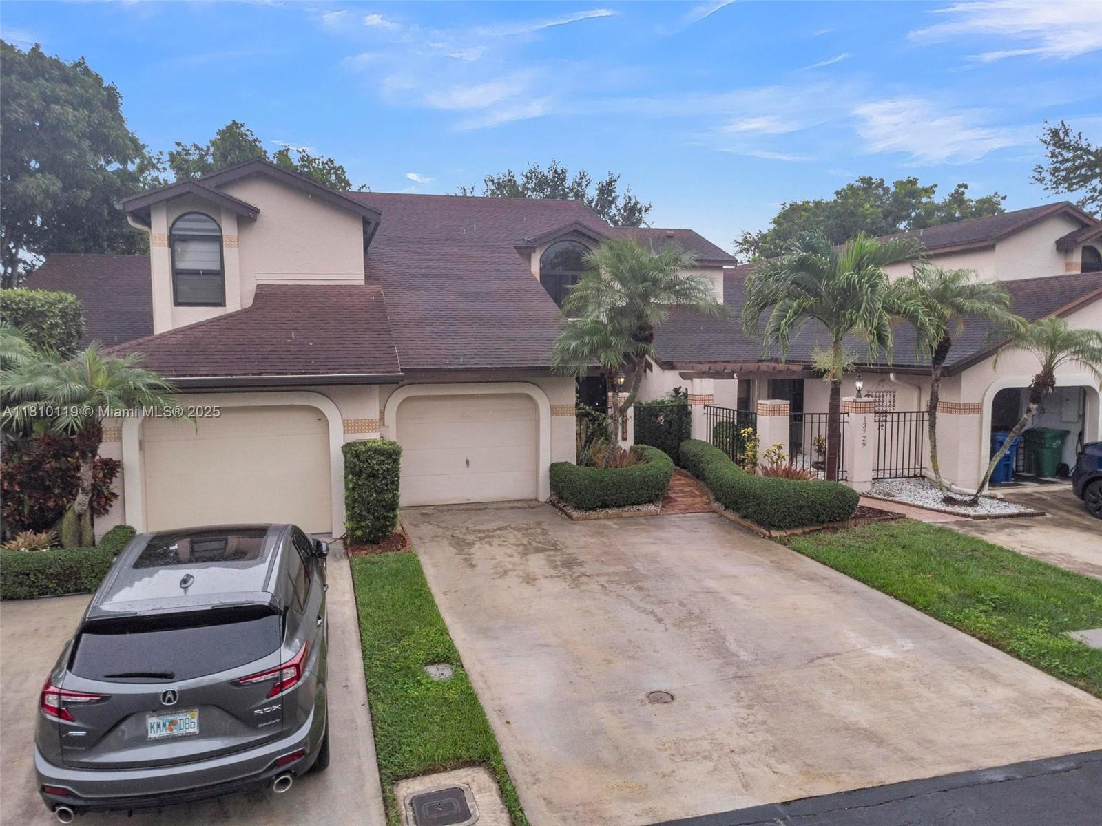 Largest model in community. 2-story townhouse located in the sought after, gated community of Valencia Townhomes. Featuring 3 bedrooms/2.5 baths and a partially converted 1 car garage. The home has newer 2018 water heater and complete ac system including ductwork; 2 upgraded baths, new ceramic flooring in second floor/stairs; it also features new electrical panel; kitchen appliances; 2024 hurricane impact windows/patio doors; new wood fence and patio tiles. Recently added attic insulation installed by Orkin. Owner maintains pest control contract with Orkin and yearly maintenance of ac system. Fenced-in courtyard entrance with privacy hedge. No rear neighbors with access to greenbelt. Feels like a single family home!! Quiet community/Low HOA fee. A Must see!!