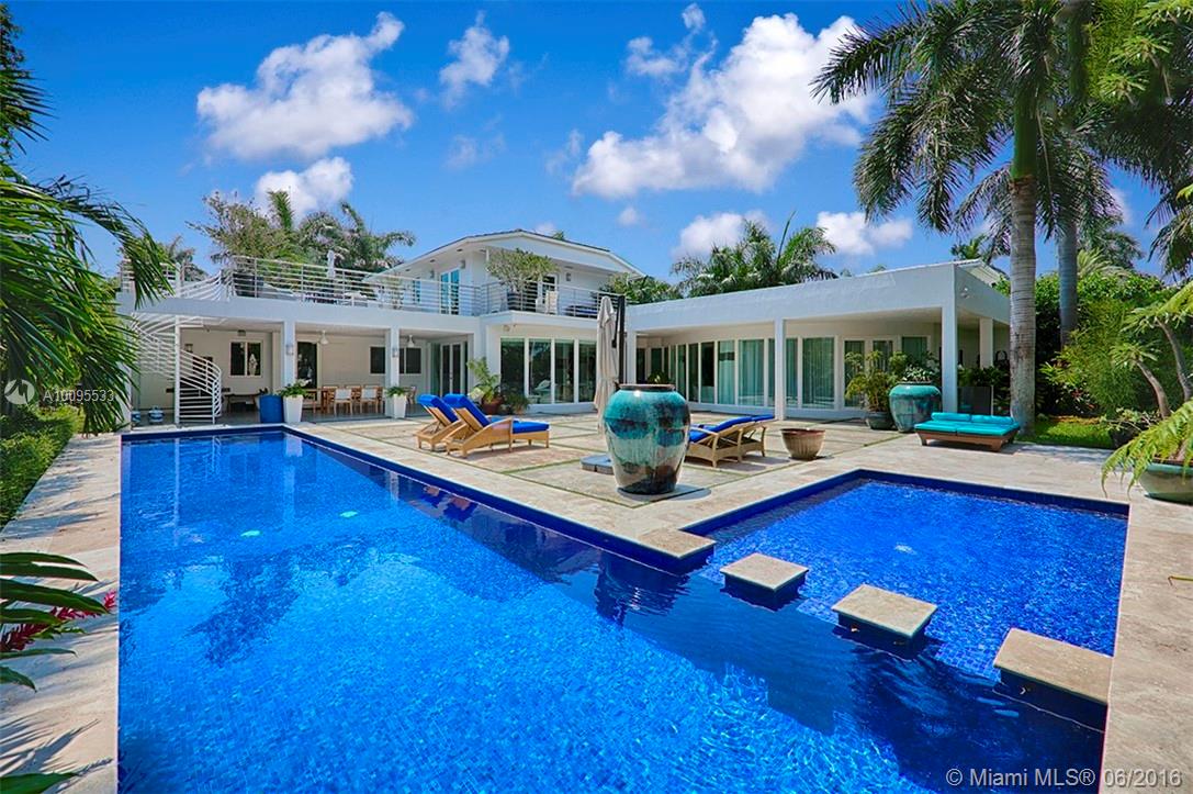 ART DECO-MODERN GEM. TOTALLY REDONE IN 2006. 5 LARGE, EN SUITE BEDROOMS/5 BATHS ON SPECTACULAR 17,500 SF LOT WITH 100 FEET OF PRIME WATERFRONT. BEAUTIFUL MARBLE FLOOR THROUGHOUT, IMPACT WINDOWS & DOORS, BRIGHT OPEN FLOOR PLAN WITH FLOOR TO CEILING WINDOWS, & GOURMET KITCHEN. LUXURIOUS MASTER SUITE WITH OVERSIZED BATH ON GROUND FLOOR OPENING TO A TROPICAL PARADISE. 50 FT COBALT BLUE MOSAIC LAP POOL, LARGE COVERED TERRACE & SUNDECK & PRIVATE DOCK WITH 15000 POUND BOAT LIFT. MUST SEE!!