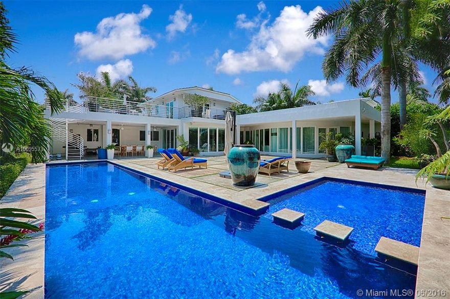 ART DECO-MODERN GEM. TOTALLY REDONE IN 2006. 5 LARGE, EN SUITE BEDROOMS/5 BATHS ON SPECTACULAR 17,500 SF LOT WITH 100 FEET OF PRIME WATERFRONT. BEAUTIFUL MARBLE FLOOR THROUGHOUT, IMPACT WINDOWS & DOORS, BRIGHT OPEN FLOOR PLAN WITH FLOOR TO CEILING WINDOWS, & GOURMET KITCHEN. LUXURIOUS MASTER SUITE WITH OVERSIZED BATH ON GROUND FLOOR OPENING TO A TROPICAL PARADISE. 50 FT COBALT BLUE MOSAIC LAP POOL, LARGE COVERED TERRACE & SUNDECK & PRIVATE DOCK WITH 15000 POUND BOAT LIFT. MUST SEE!!