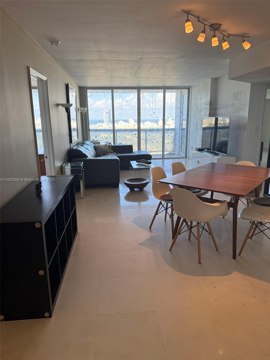 BREATHTAKING PANORAMIC VIEWS!LINE 11 24TH FLOOR SQFT 1380 2/2 Live the Miami dream lifestyle in this waterfront condo, high above Sunset Harbour Yacht Club. Stylish 2/2 with wall to wall sliding glass framing endless views of Biscayne Bay, Miami skyline + the private marina. Host your next cocktail party on the private 30 foot terrace! Classic marble floors, sleek , generous walk-in closets, One garage + 1 free valet space + electric charging keeps you mobile. doorman, 2 pools, gym, sauna + storage. Your new playground is the most dynamic neighborhood with a waterfront boardwalk, gourmet restaurants, local cafes, fitness boutiques like Sweat440 and Barry's Bootcamp, water sports, playgrounds + shopping.