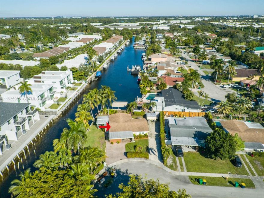 Experience the ultimate South Florida waterfront lifestyle in this meticulously maintained single-family home located on a quiet residential street. This boater’s dream property features a rare 120-foot seawall and a private wood dock with deep-water canal access to the Atlantic Ocean, plus a nearby public boat ramp for added convenience. Designed for comfortable living and entertaining, the home offers a spacious 3-bedroom, 2-bath split floor plan with an open-concept kitchen, formal living room, and a bright family room that flows seamlessly through dual sliding doors to the outdoor living area. Enjoy year-round coastal living from the screened waterfront porch or the open patio perfect for relaxing, hosting guests, and taking in the water views. The residence is move-in ready and upgraded with hurricane-impact windows and doors, providing enhanced safety and peace of mind. With no HOA and generous parking space for a boat, RV, or trailer, this property offers exceptional flexibility and freedom. Ideally located near major entertainment, dining, shopping, and the airport, this waterfront gem combines prime location, lifestyle, and functionality a rare opportunity for buyers seeking the best of South Florida living.